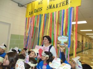 Bertrand reads to a group of San Antonio elementary students during a recent visit.