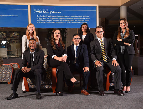A group of Greehey Scholars in the Alkek Atrium.