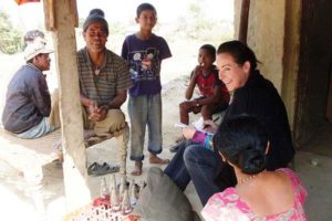 Professor Kathleen Gallagher, Ph.D., interacts with people from recently liberated slave populations in Kohalpur, Nepal.