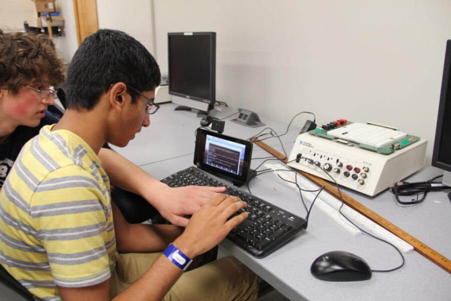 Two summer campers program a Raspberry Pi