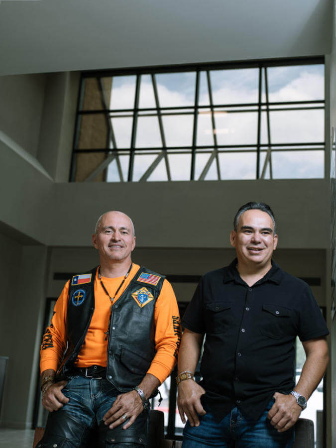 EJ and Luis Tamez stand in a hospital waiting room
