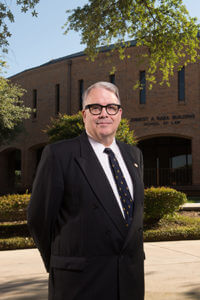 School of Law Dean Stephen M. Sheppard stands in front of the Raba Building.