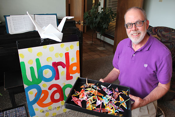 Brother Brian Zampier with his origami cranes.